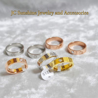 JC Sunshine Jewelry and Accessories rose gold, silver, and gold stainless steel rings with CZ crystals and cross detail. Classic style, 5mm width.