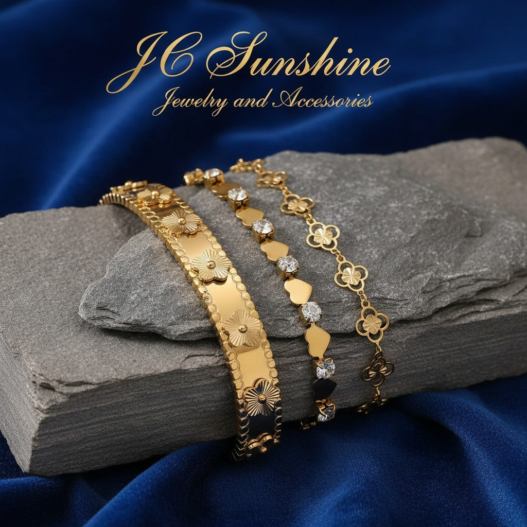 JC Sunshine Jewelry and Accessories gold-plated stainless steel cuff bracelet with flower motifs and cubic zirconia accents.