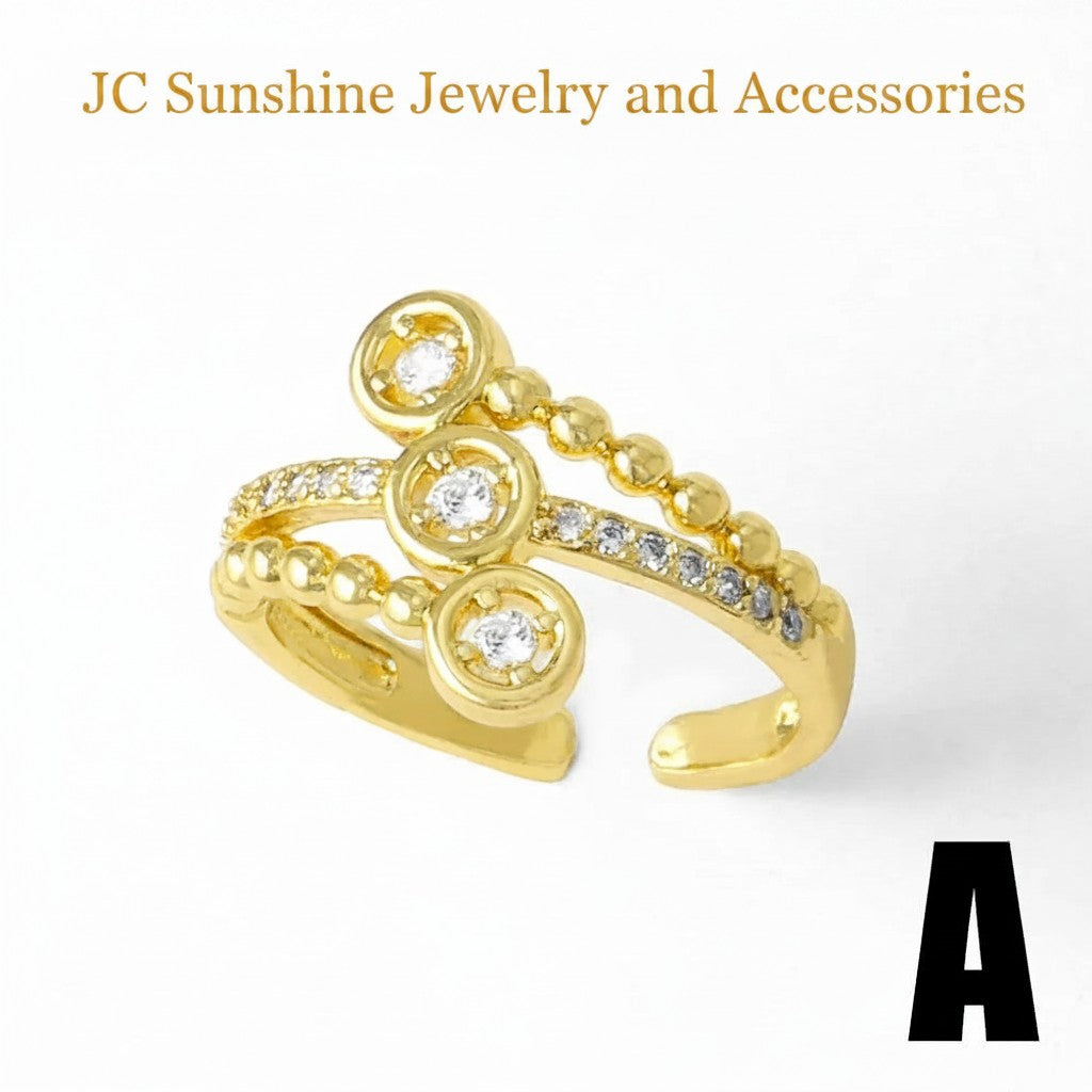 JC Sunshine Jewelry and Accessories gold-plated copper ring with cubic zirconia accents and a beaded detail. Open design.