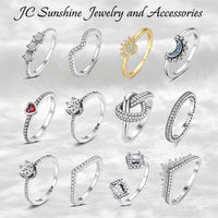 JC Sunshine Jewelry: Assortment of 12 sterling silver and gold rings with cubic zirconia, featuring hearts, moons, suns, and geometric designs.