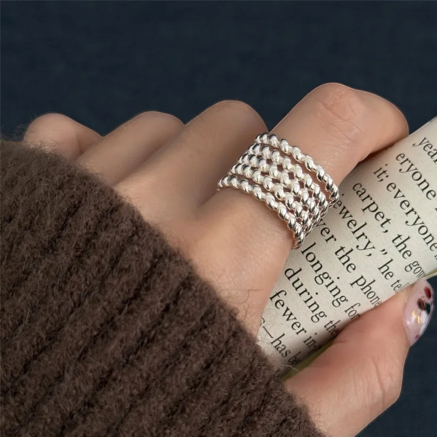 JC Sunshine Jewelry and Accessories women's wide band sterling silver ring with a multi-strand beaded chain knot design.